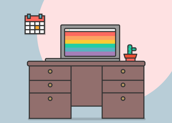 Sobre un escritorio, se encuentra un computador con los colores LGTBI+ .